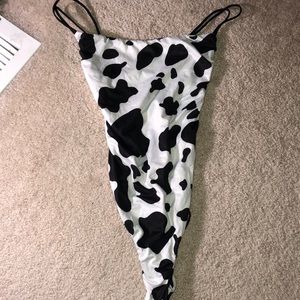 Women’s black & white cow print one piece exotic dancer outfit or a bodysuit